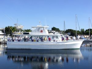 Family enjoying a drift fishing trip on a charter boat in Miami